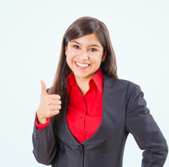 Happy businesswoman giving thumbs up