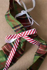 christmas cloth ribbons on plain brown paper