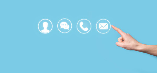 Businessman hand holding,pressing on icon phone, mail, telephone,message,post and person,user. Customer service call center contact us concept.Banner,copy space.Contact Methods.