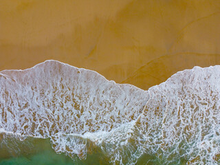 Beach with turquoise sea water, aerial drone shot, Top view of beautiful white sand