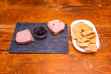 Portions of foie with red fruit jam with Andalusian scolds for dipping
