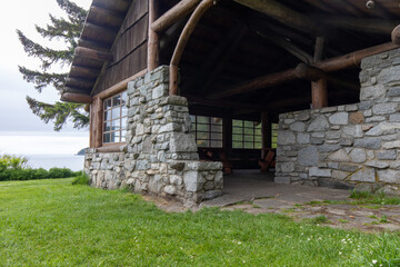 Fototapeta na wymiar Stone house and meadow at Bowman Bay Deception Pass State Park in Washington during summer.