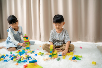 Childrens playing with colorful blocks together at home,Educational toys for child.