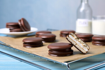 Tasty choco pies on cooling rack. Snack cakes