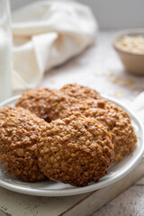 Close up homemade oat cookies, healthy snack over bright background