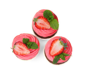 Sweet cupcakes with fresh strawberries on white background, top view