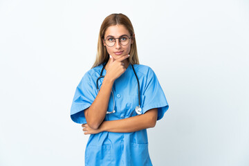 Surgeon doctor woman over isolated white background thinking