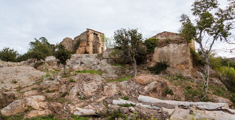 Fototapeta na wymiar ruins of houses on rocky hill