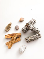 beautiful layout of palo santo and white sage, aromatherapy and incense on a white background....