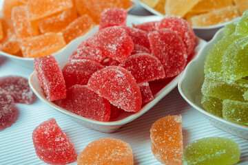 Dessert marmalade in the form of lemon and orange slices. The sweetness of jelly candy.