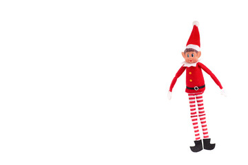Christmas Elf toy on an isolated white background with copy space. Christmas spirit, Christmas tradition. - obrazy, fototapety, plakaty