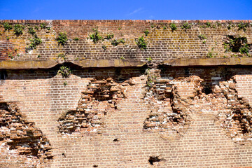 Savannah, Georgia: Fort Pulaski National Monument. American Civil War fort, Confederate Army surrendered fort to Union Army after rifled cannon siege. Damaged wall with craters, pock, and shots. © EWY Media