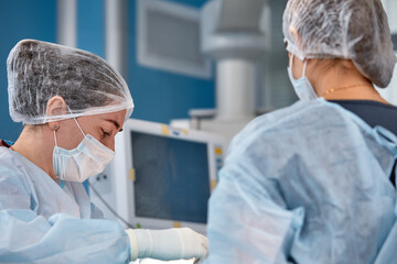 Concentrated Surgical team operating a patient in an operation theater.