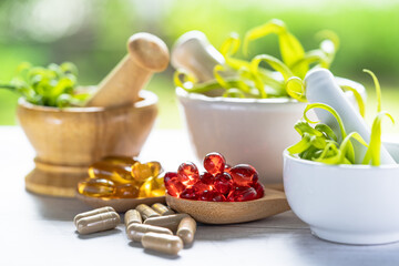 Obraz na płótnie Canvas Alternative medicine nature herbal organic capsule, drug with herbs leaf natural supplements for healthy good life.