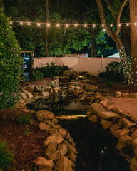 small garden fountain into a rock stream