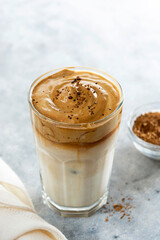 Iced dalgona coffee, frothy creamy whipped coffee cold drink