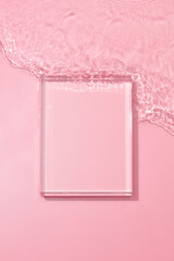 Transparent pink colored clear water surface texture with ripples, splashes and bubbles ,  Abstract...