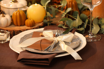 Beautiful autumn place setting and decor on table