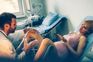 Obraz premium Gynecologist examination woman patient in a gynecological chair. Female health concept.