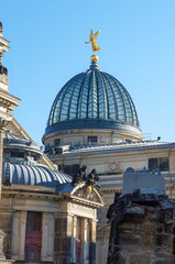 Golden statue on a glass dome in the old city in Europe
