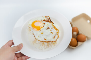 Simple food, rice, fried egg, appetizing on a white background.