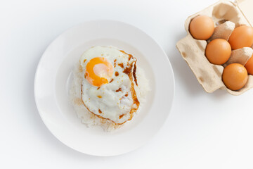 Simple food, rice, fried egg, appetizing on a white background.
