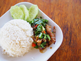 Rice topped with stir fried pork and basil.