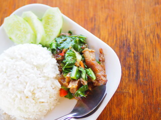 Rice topped with stir fried pork and basil.