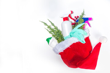 Christmas cleaning concept. Various bottles, equipment, and accessories, gloves for cleaning with...