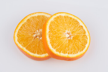 Sliced circles of orange citrus fruit isolated on white background, clipping path