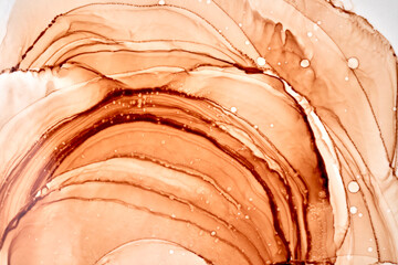 Abstract ocher ink watercolor background. Yellow orange brown paint stains and spots in water,...