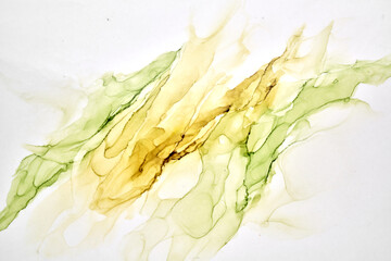 Abstract ocher green watercolor background. Yellow orange brown paint stains and spots in water,...