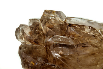 Macro mineral stone smoky quartz, rauchtopaz on a white background