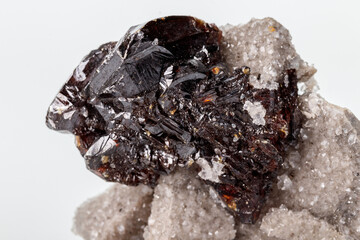 Macro of mineral Sphalerite stone on microcline on white background