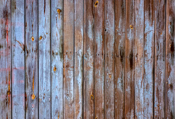 A wooden wall with an aged surface.
Vintage wall and floor made of darkened wood, realistic plank texture.
 Empty room interior background.