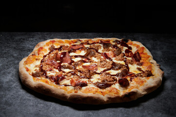 pizza with cheese and various ingredients