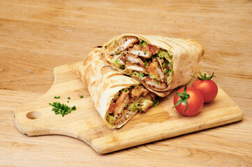 Wraps with vegetables and meat, isolated.