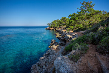 Fototapeta na wymiar Travel in Turkey along the Lycian trail along the sea to the ancient city of Phaselis. The indescribable beauty of the small bays of the Mediterranean Sea.