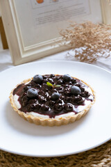 Delicious Blueberry Cheese Pie on white cafe table.