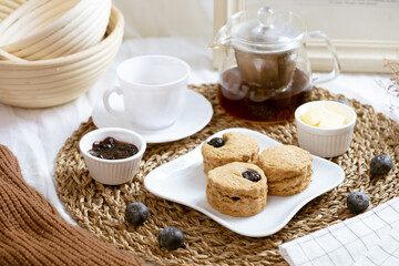 Delicious blueberry Scones on white cafe table.