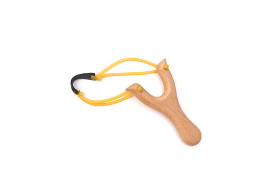 closeup wooden slingshot isolated on white background. Argentine horned frog.