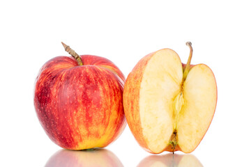 One half and one whole sweet juicy apple, close-up, isolated on white.