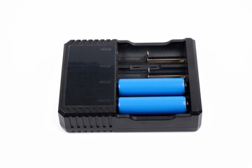 battery charger, with two batteries in it, isolated on a white background