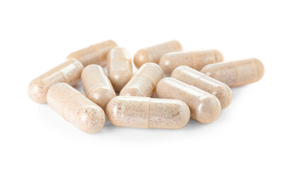 Many transparent gelatin capsules on white background