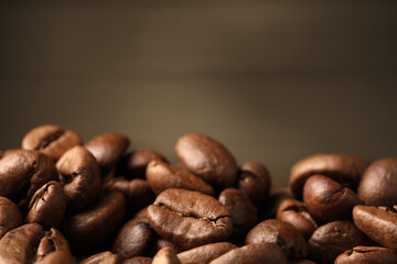 Fototapeta premium Heap of aromatic roasted coffee beans, closeup