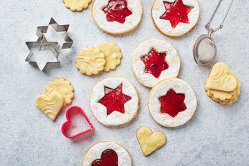 Fototapeta na wymiar Classic Linzer Christmas Cookies with raspberry or strawberry jam on light background.