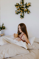 Young woman enjoys the morning silence in her room