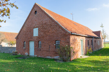 Fototapeta na wymiar Old barn with red clinker in Denmark