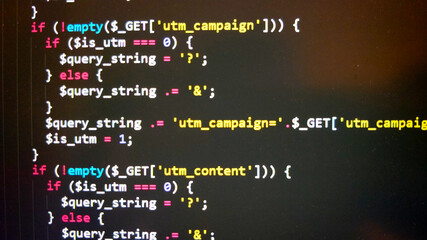 Close-up view on piece of PHP code written on the screen. The code is highlighted using special software.