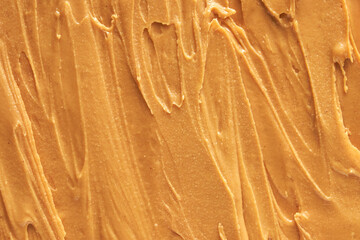 Fototapeta na wymiar Peanut butter texture. Spread swirl. Organic keto food. Healthy creamy paste. Smooth closeup brown desert. Crunchy macro snack. Fat salt breakfast